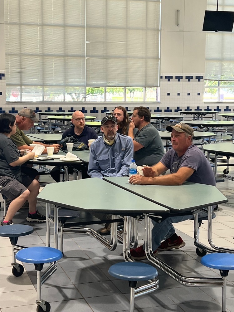 custodians meeting in the cafeteria