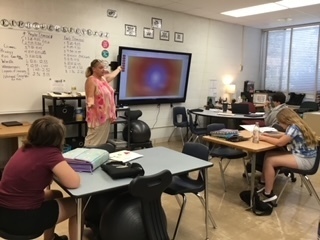 Tammy Reindl working with 6th grade