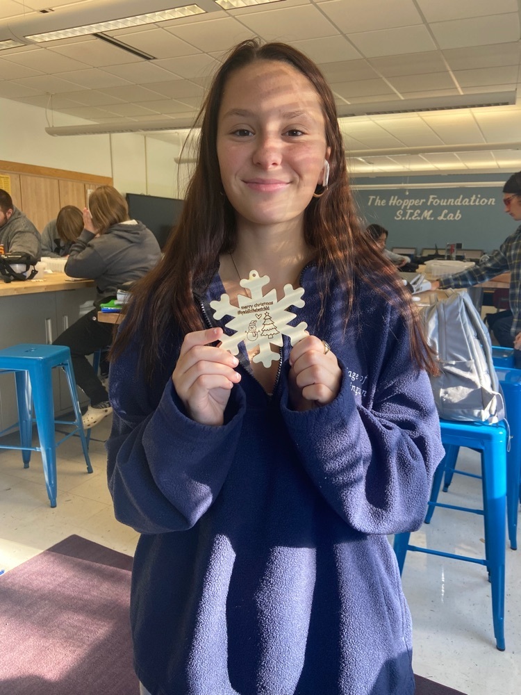 student holding ornament