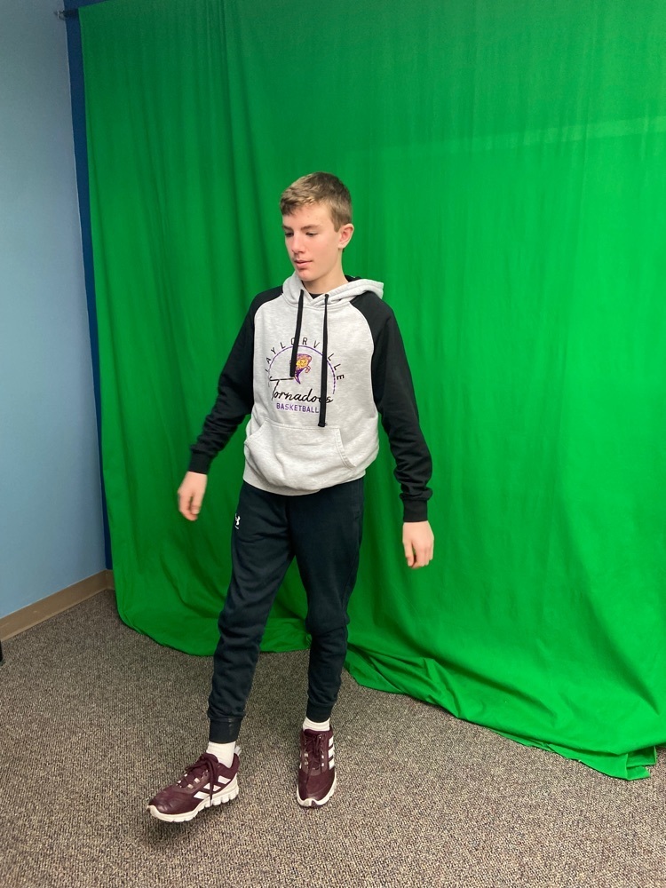 student working with green screen